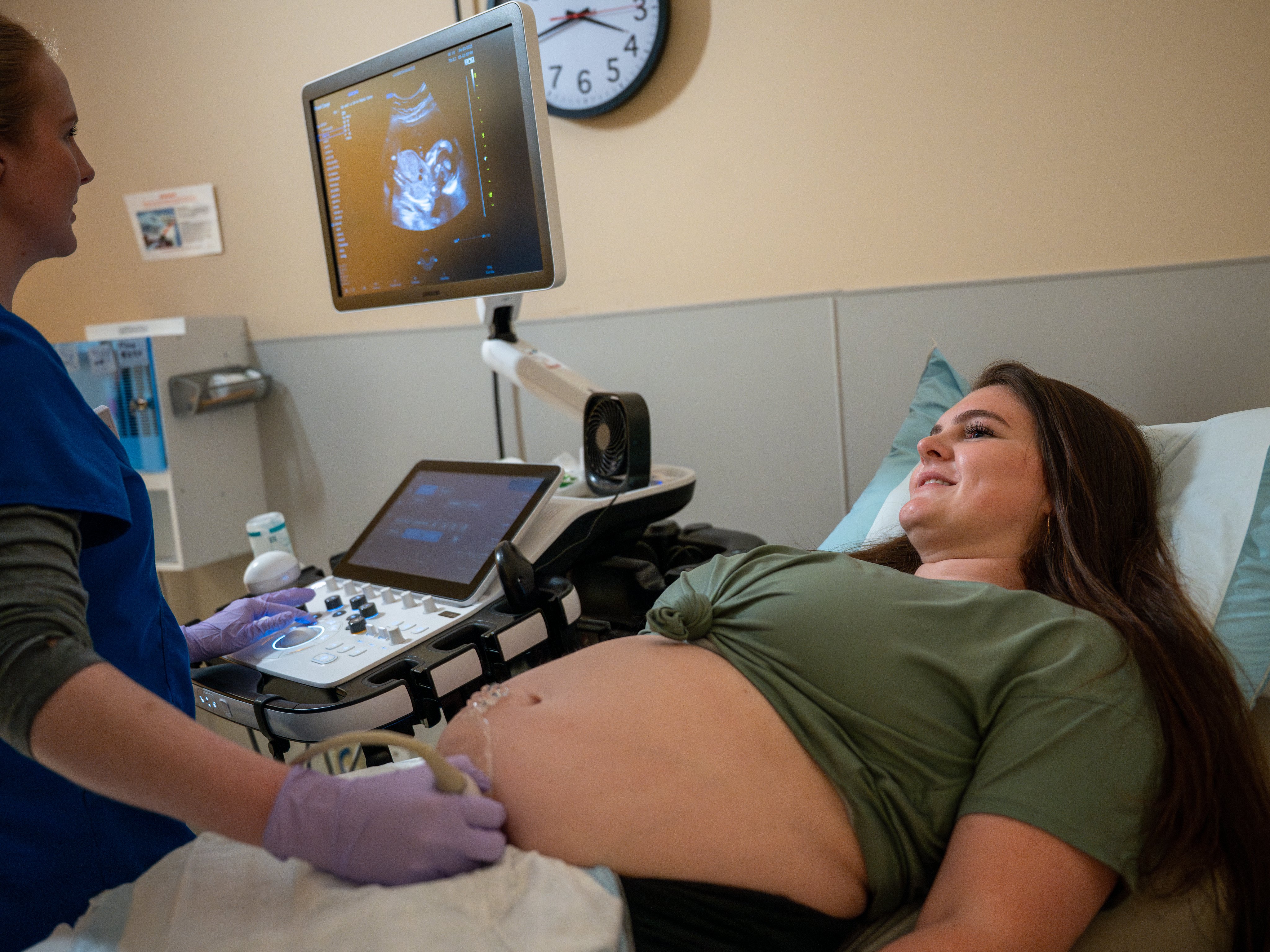 Young woman gets ultrasound at her prenatal appointment