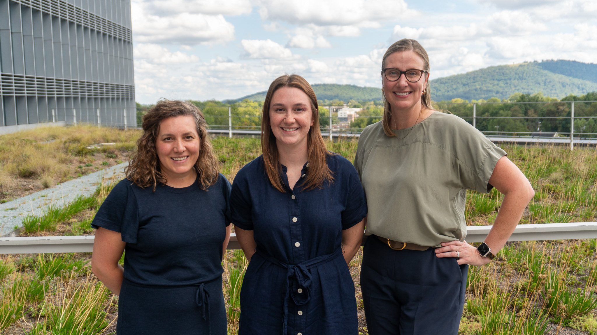 3 young pharmacy residents stand on grounds at UVA Health
