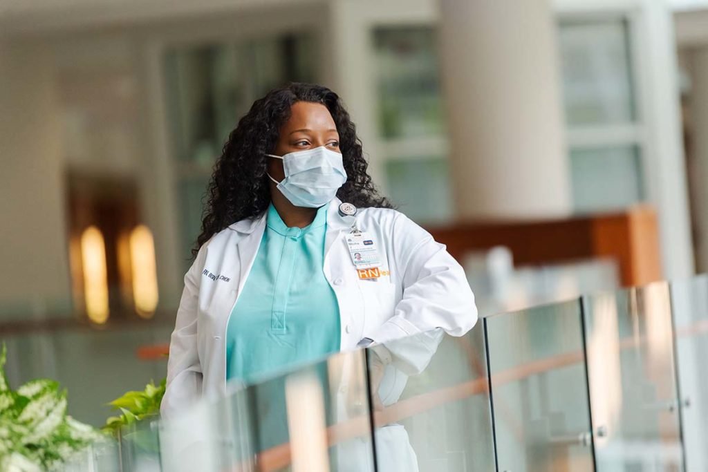 UVA Nurse looks out over the lobby