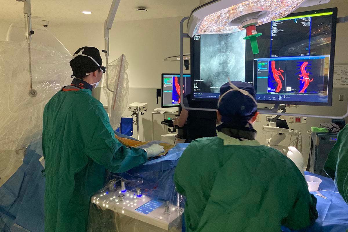 UVA Health Aortic Center co-director Bezhad Farivar, MD, performs a procedure with a fellow