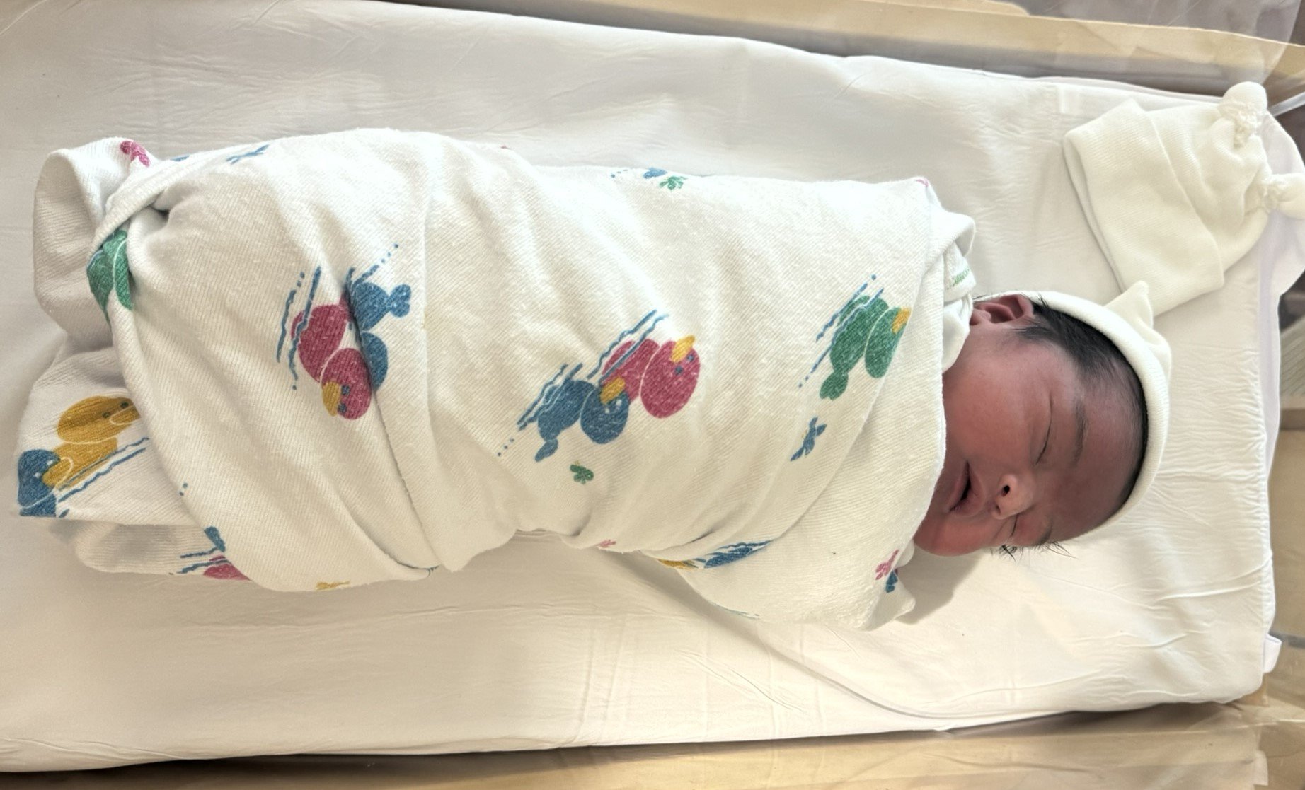 Picture of baby Ailany in hospital bed.