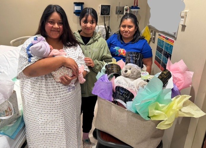 Mother Greysi with baby Lilieth and sister and mother of Geysi