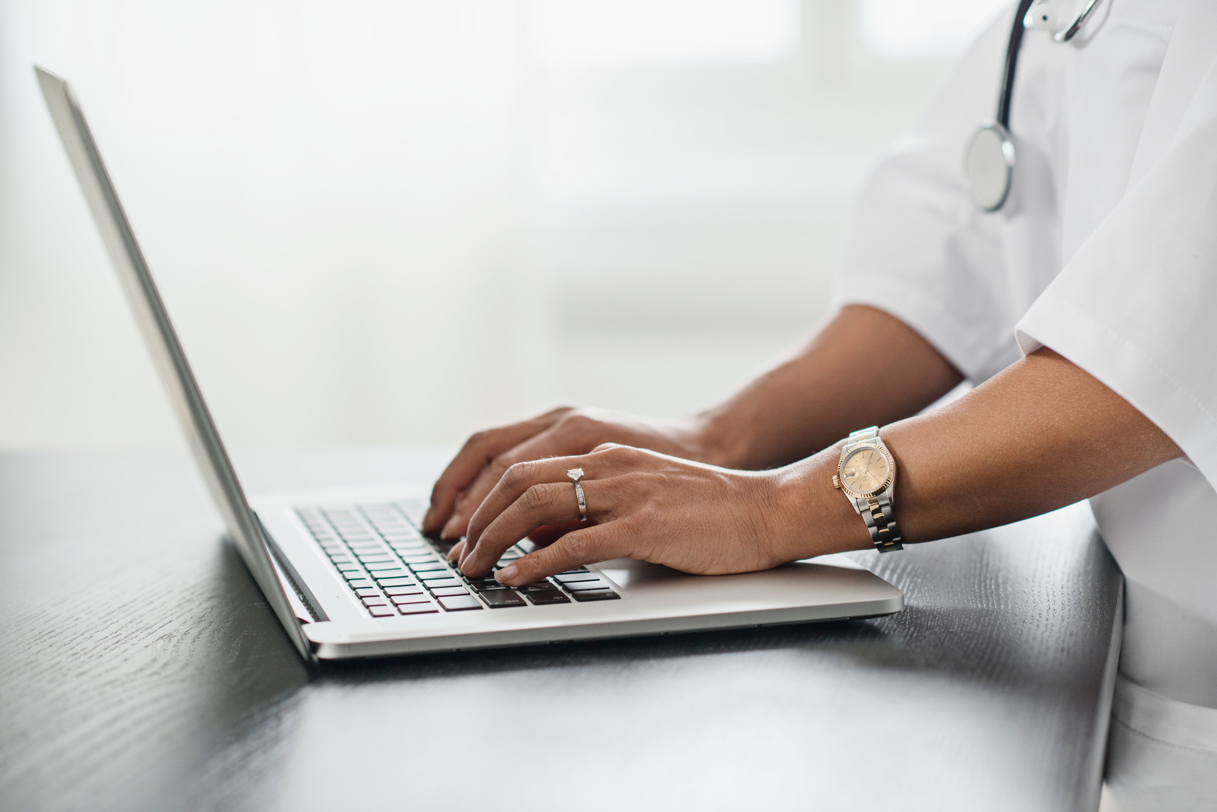 Female doctor using laptop