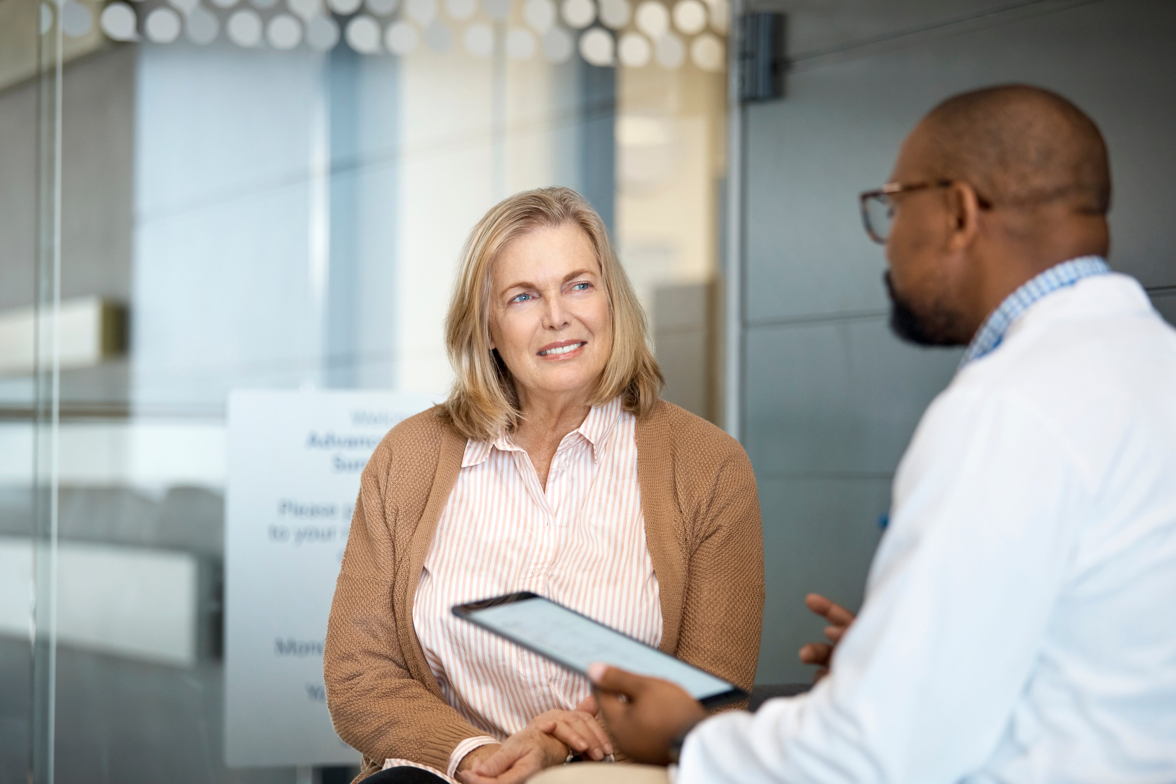 A doctor talks with a woman