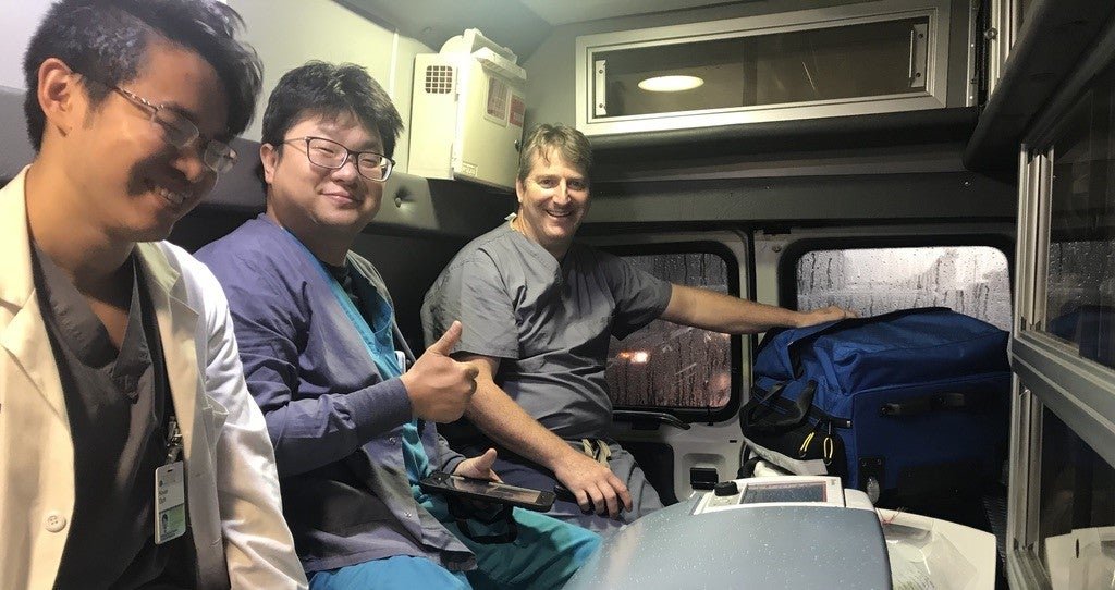 Transplant Team Delivering a Life-Saving Organ to a Patient