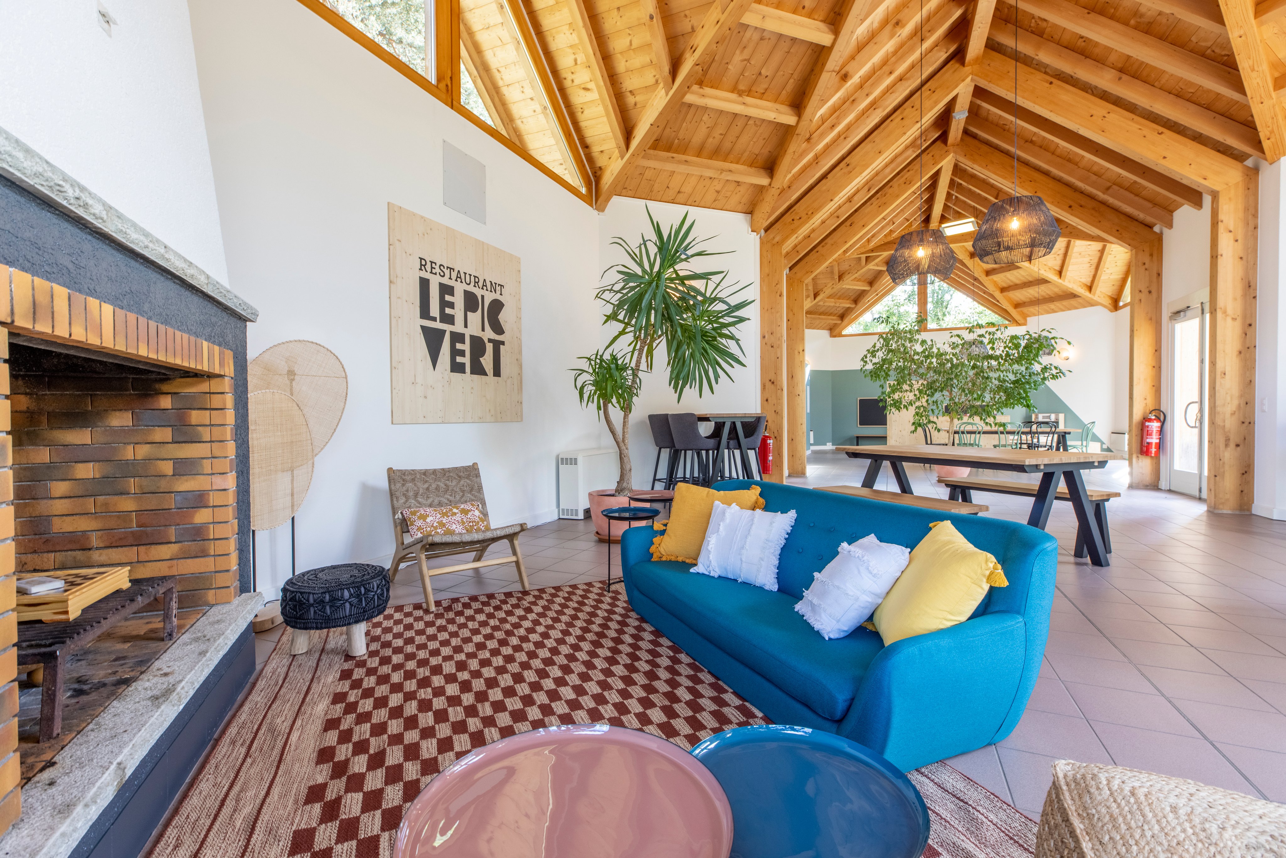 Lounge with sofa and tables on a campsite.