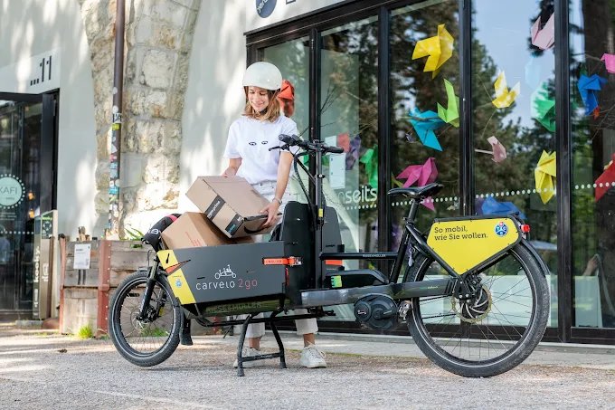 Woman on the road with TCS carvelo Cargobike