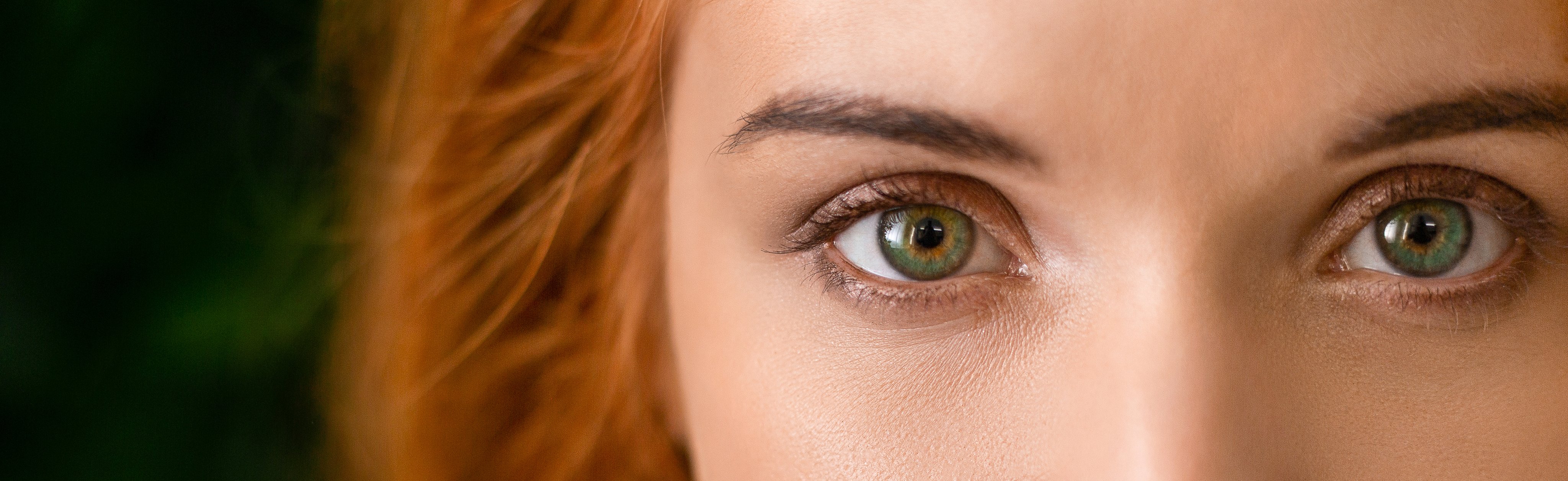 green eyes of a woman with red hair
