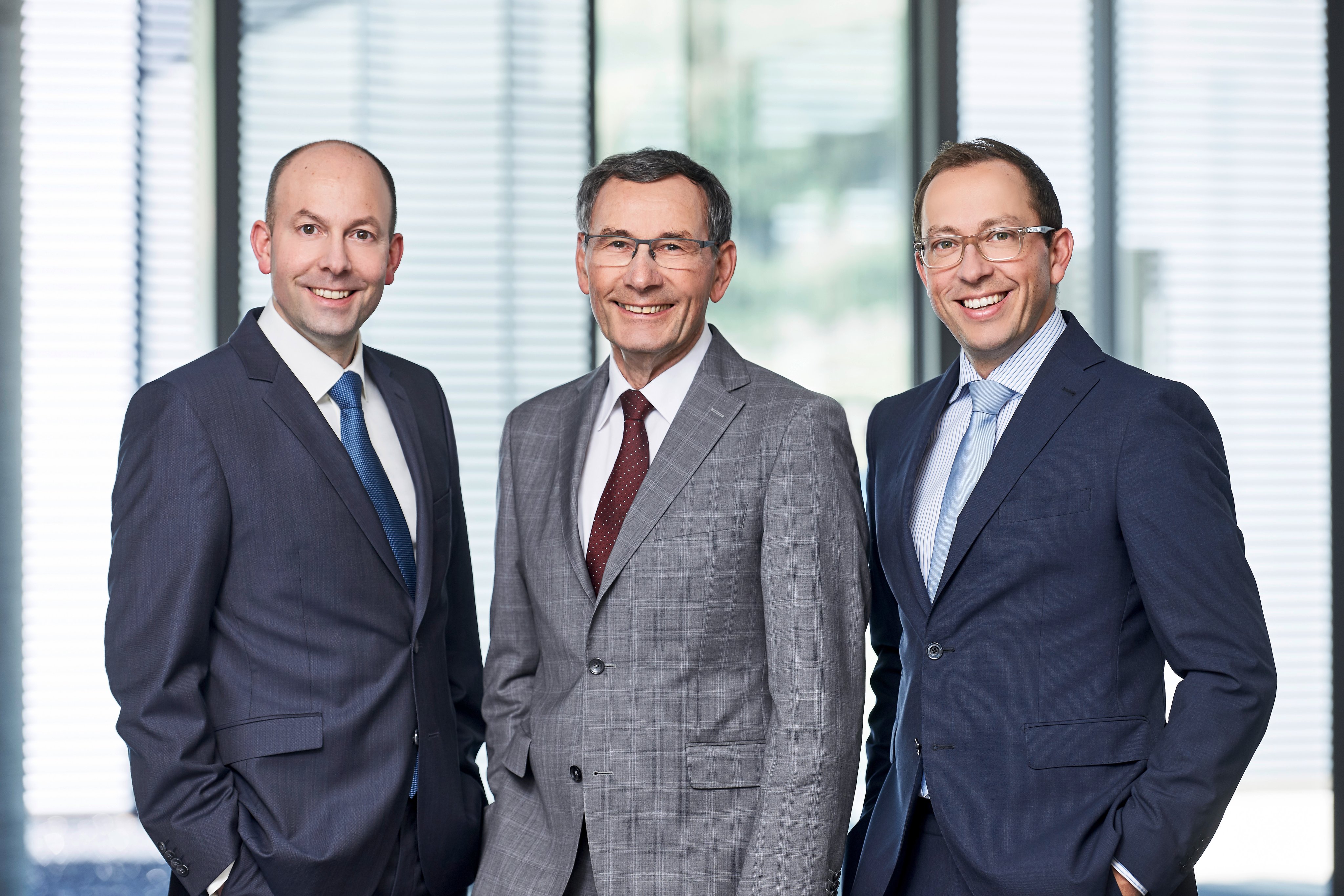 Oertli CEOs and family members posing for a professional portrait in an office setting