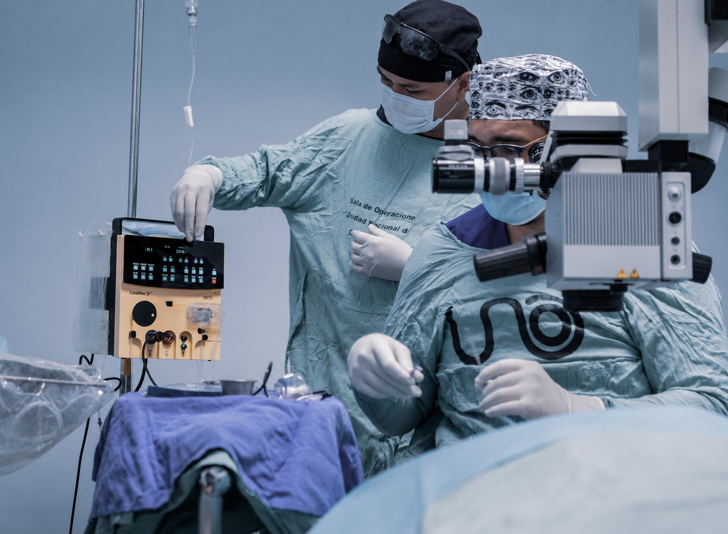 Ophthalmic surgical team using the CataRhex 3 surgical platform during a procedure in an operating room