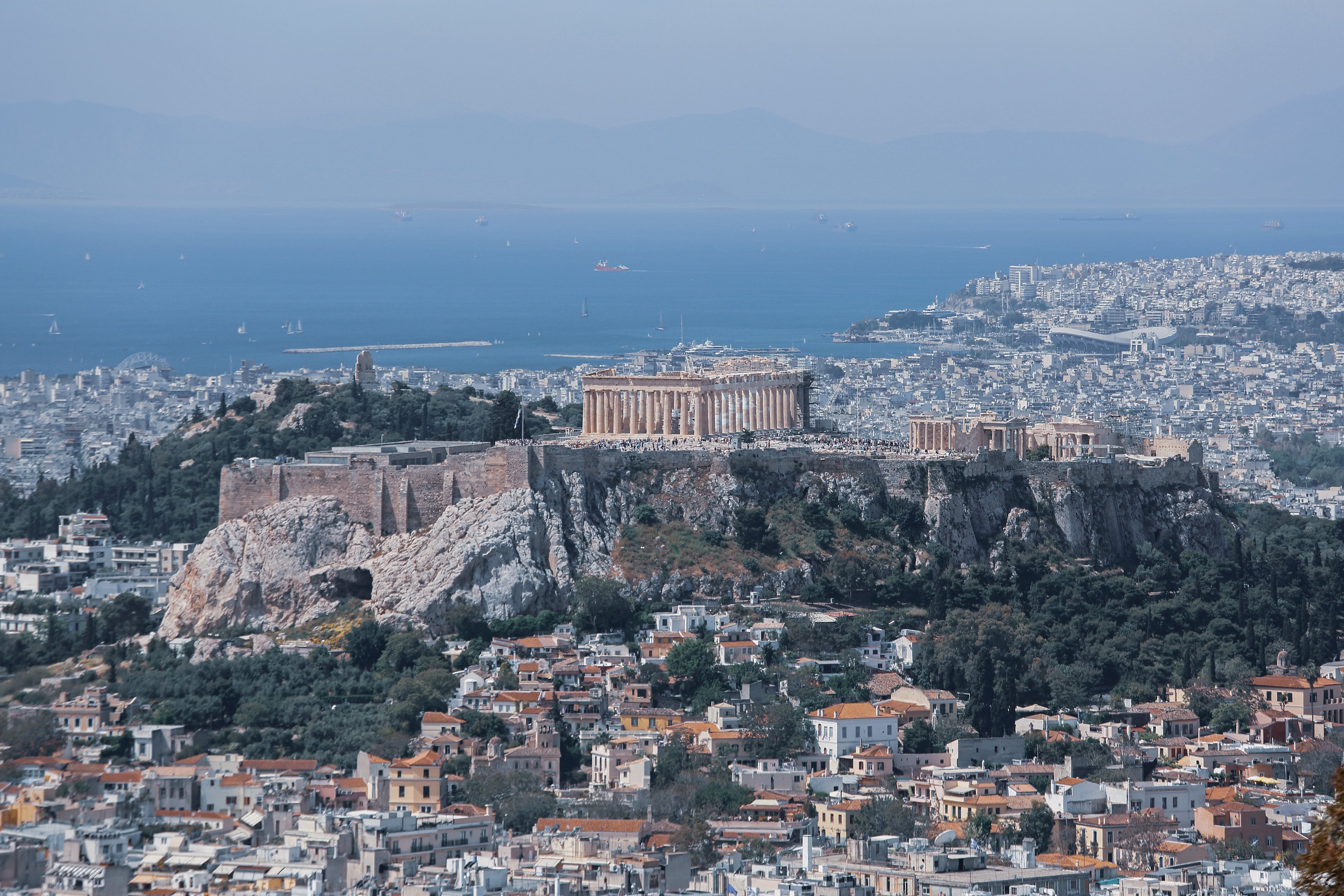 Athens city view with the Acropolis and Parthenon overlooking the city and coastline