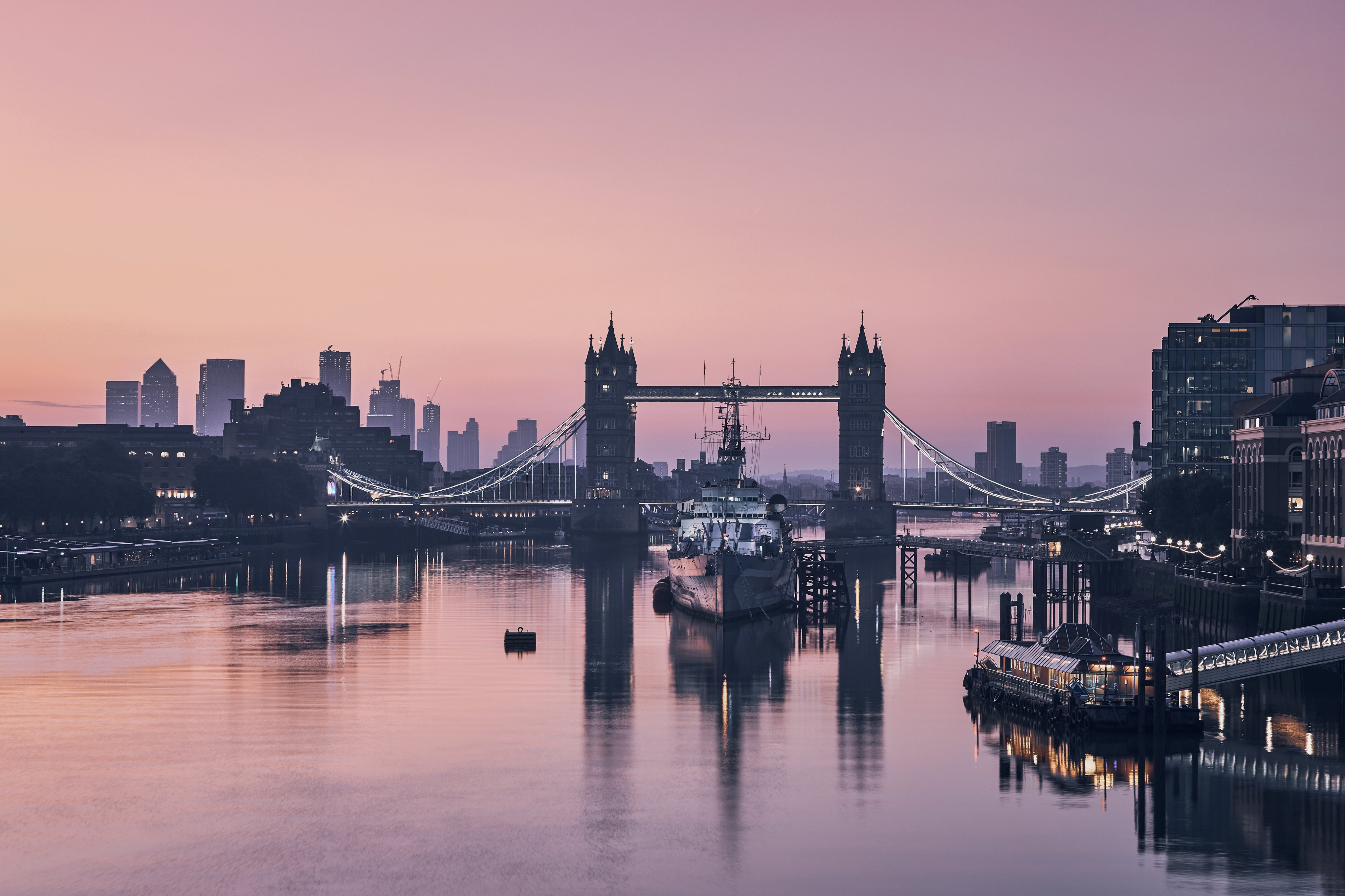 London skyline at sunset with Tower Bridge over the River Thames
