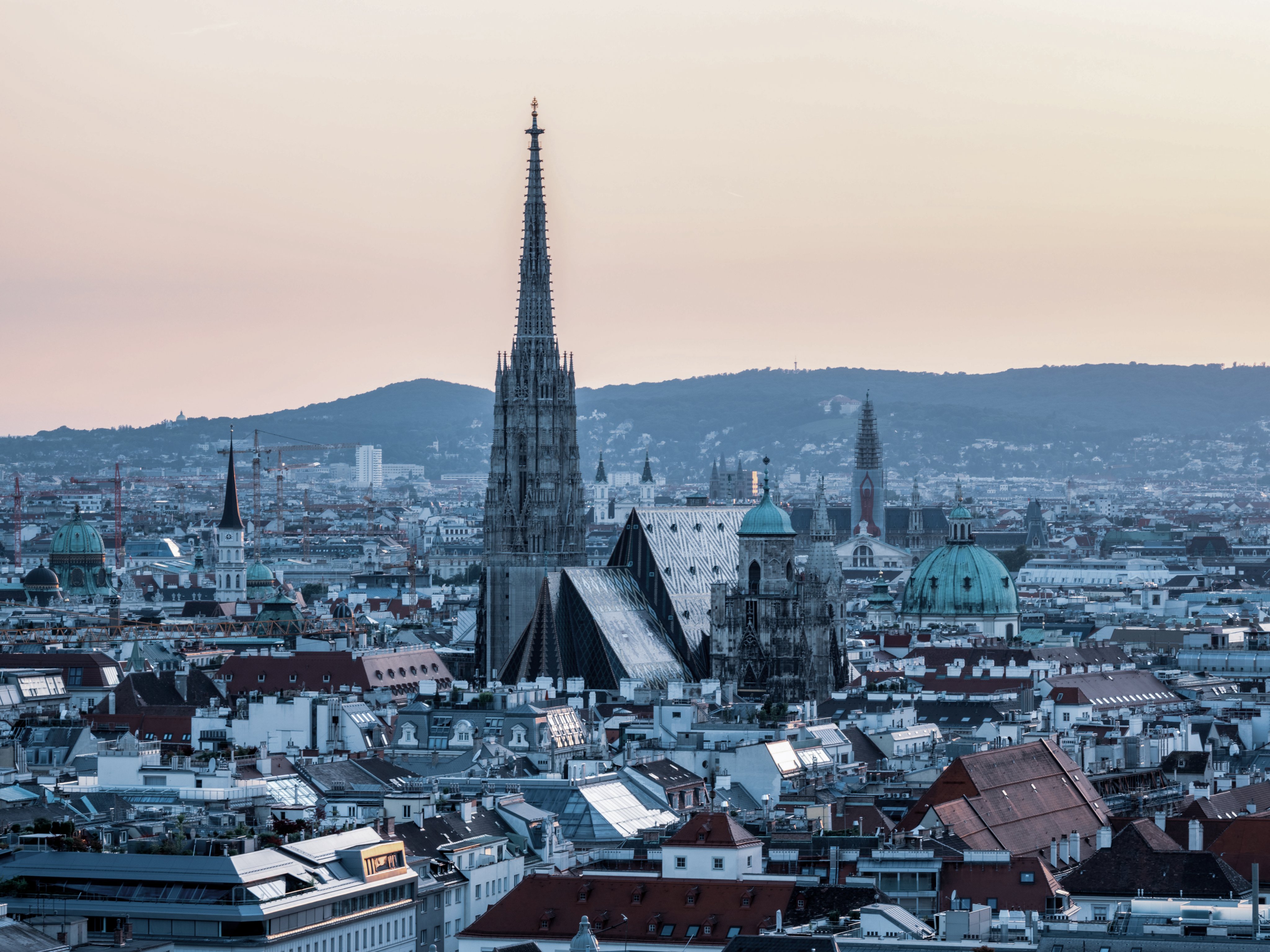Vienna skyline with St. Stephen’s Cathedral and historic city rooftops at dusk