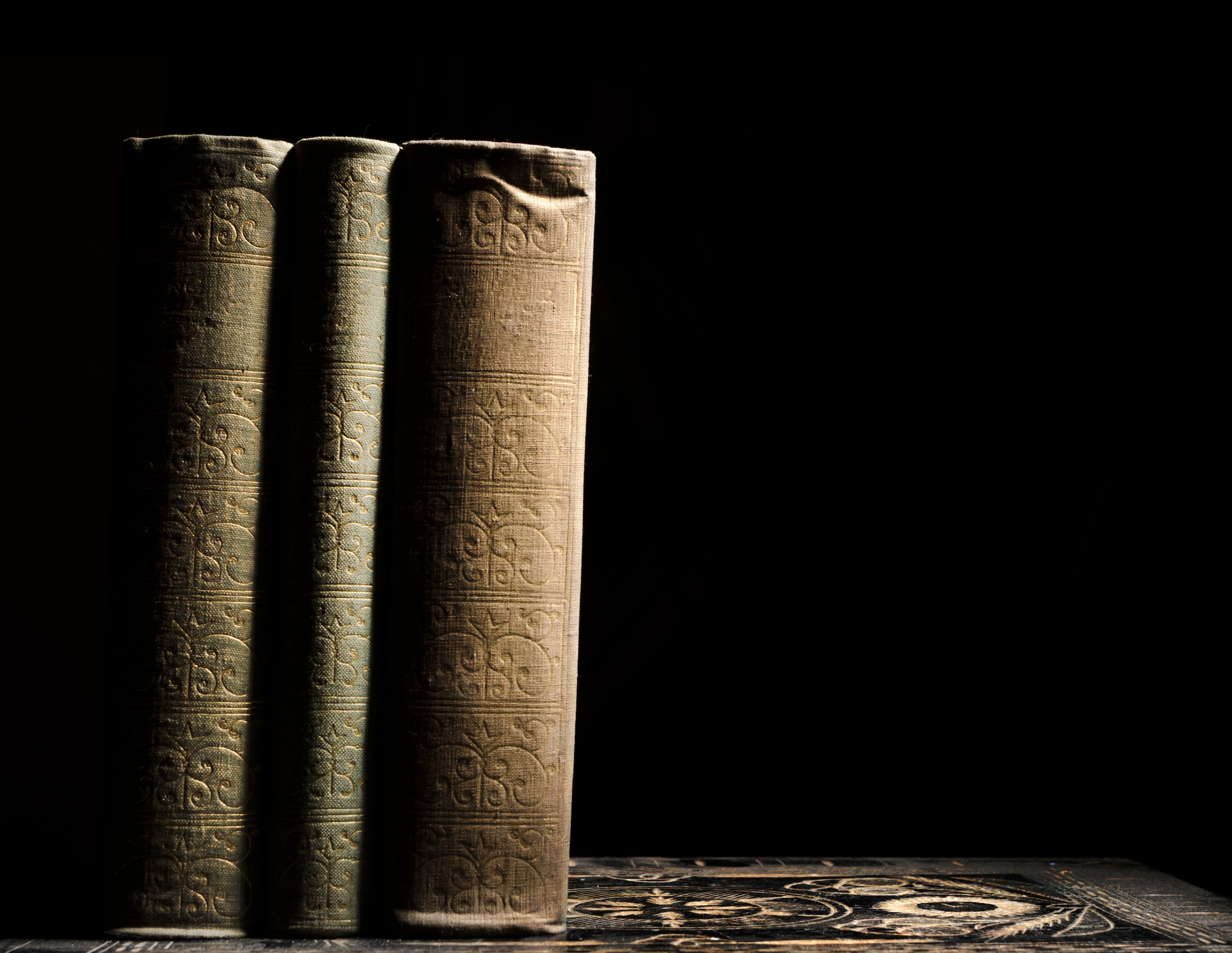 Old books in fornt of black background