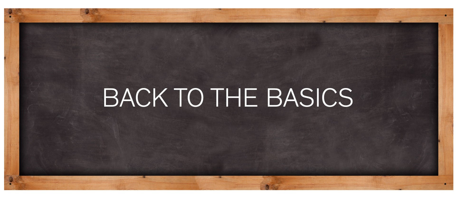 Chalkboard with the text “Back to the basics” in white lettering
