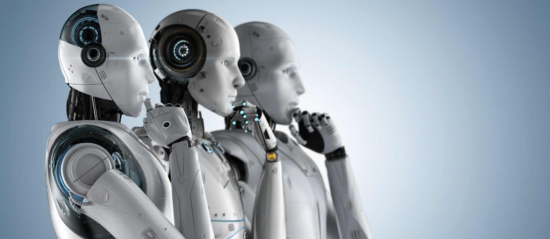 Three humanoid robots in profile, symbolising artificial intelligence, automation and the evolving role of technology in modern surgery