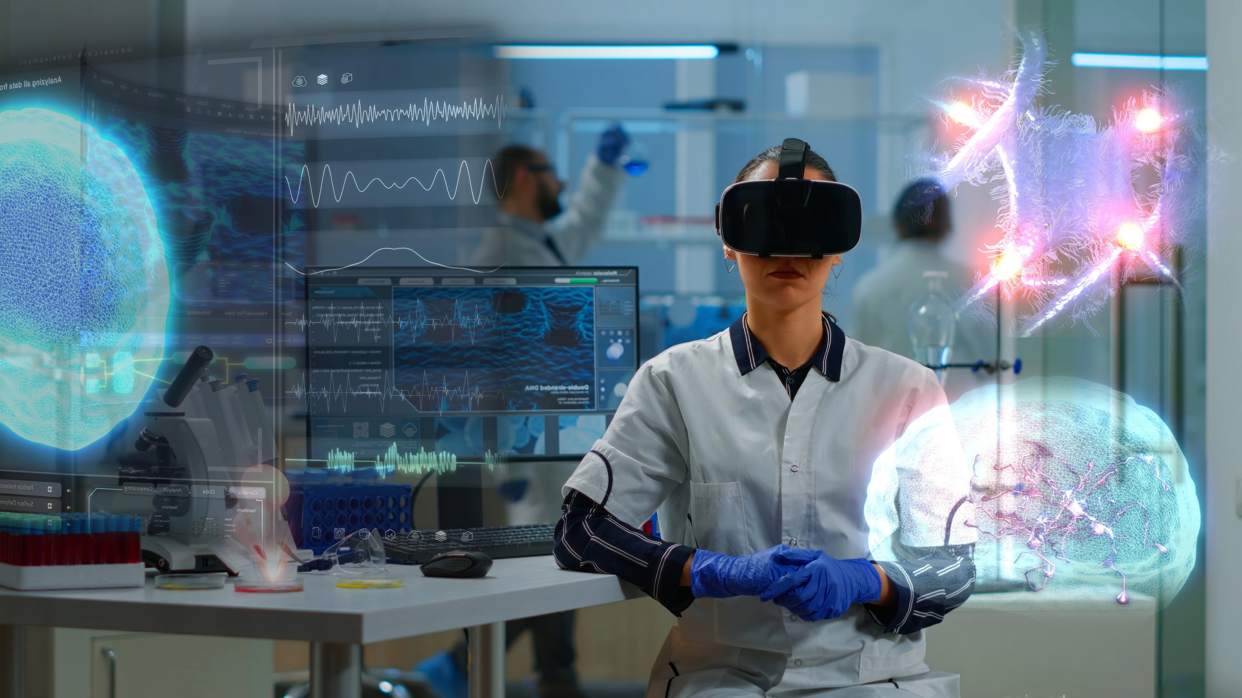 Scientific specialist in research lab wearing VR goggles using high tech equipment and wired sensors to do medical study. Healthcare practitioner using virtual reality technology to visualize datasets