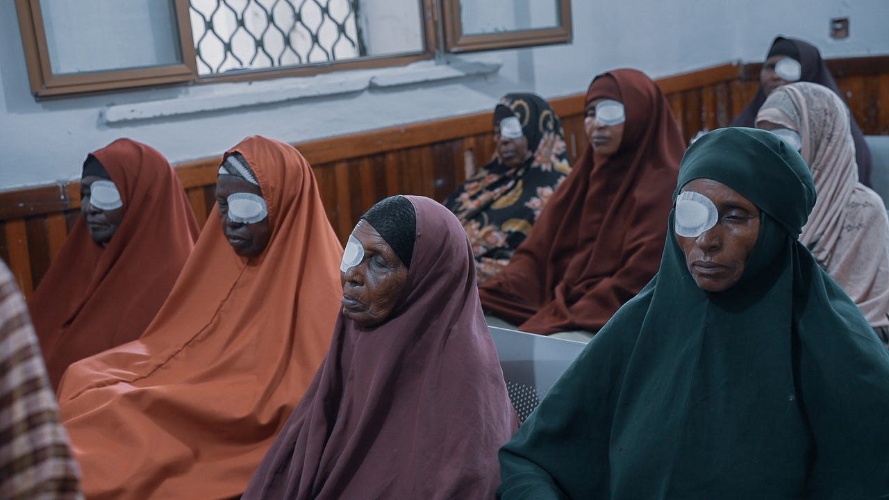 Patients wearing protective eye patches while recovering after cataract surgery at an eye clinic