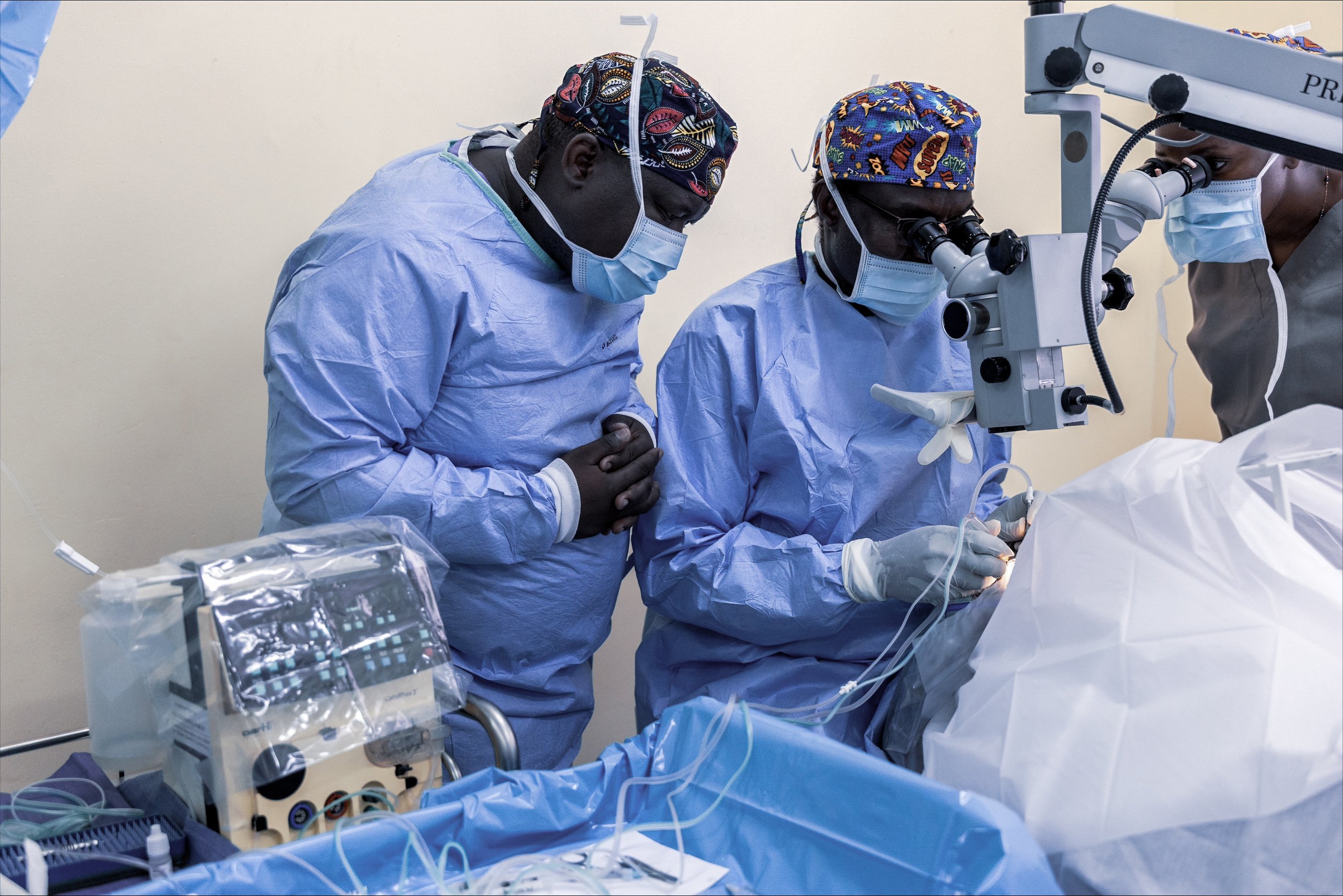 Surgeons perform eye surgery with an ophthalmic surgical platform during an eye care outreach programme