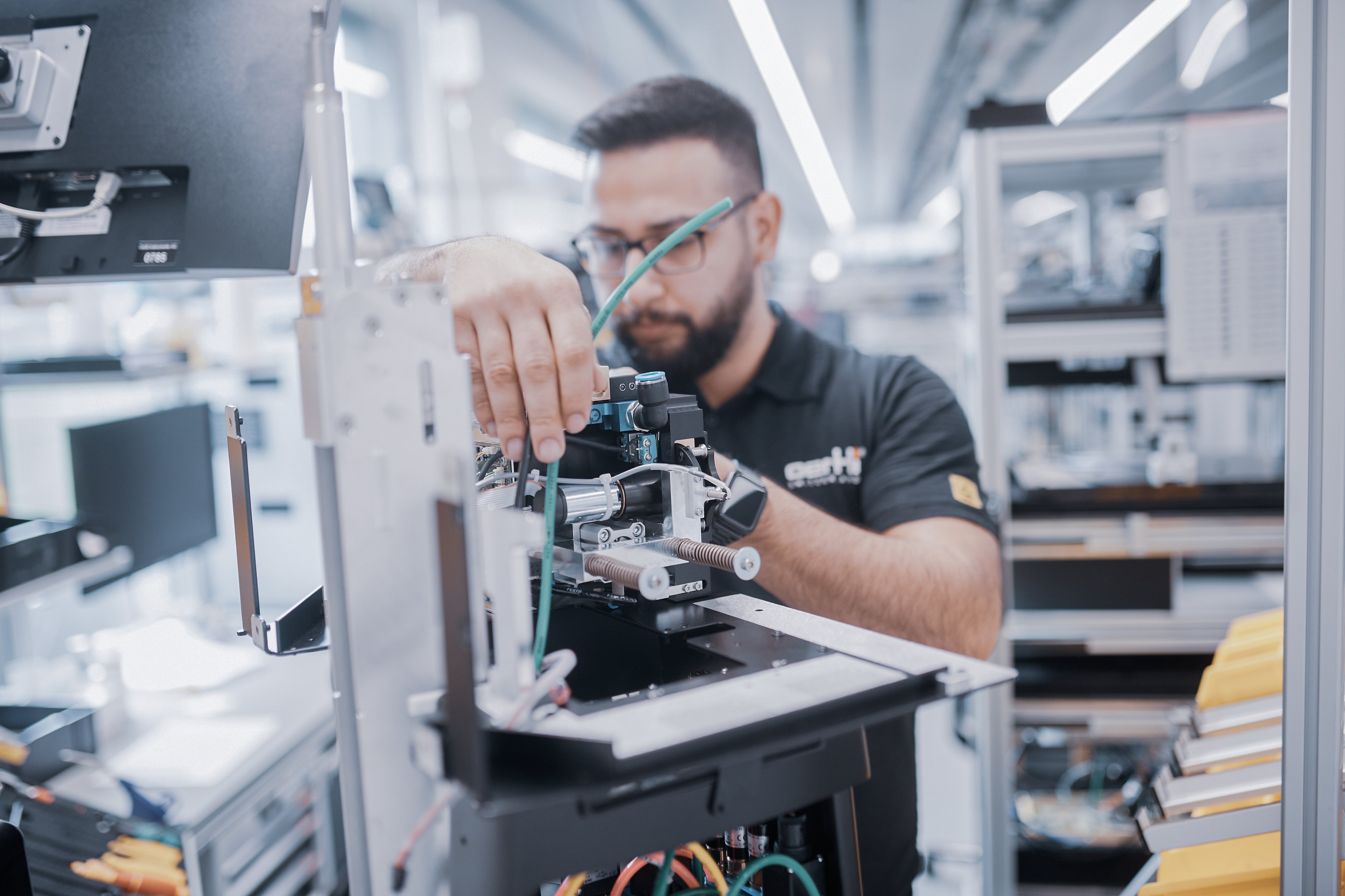 Oertli employee assembling components of an ophthalmic surgical device in the manufacturing area