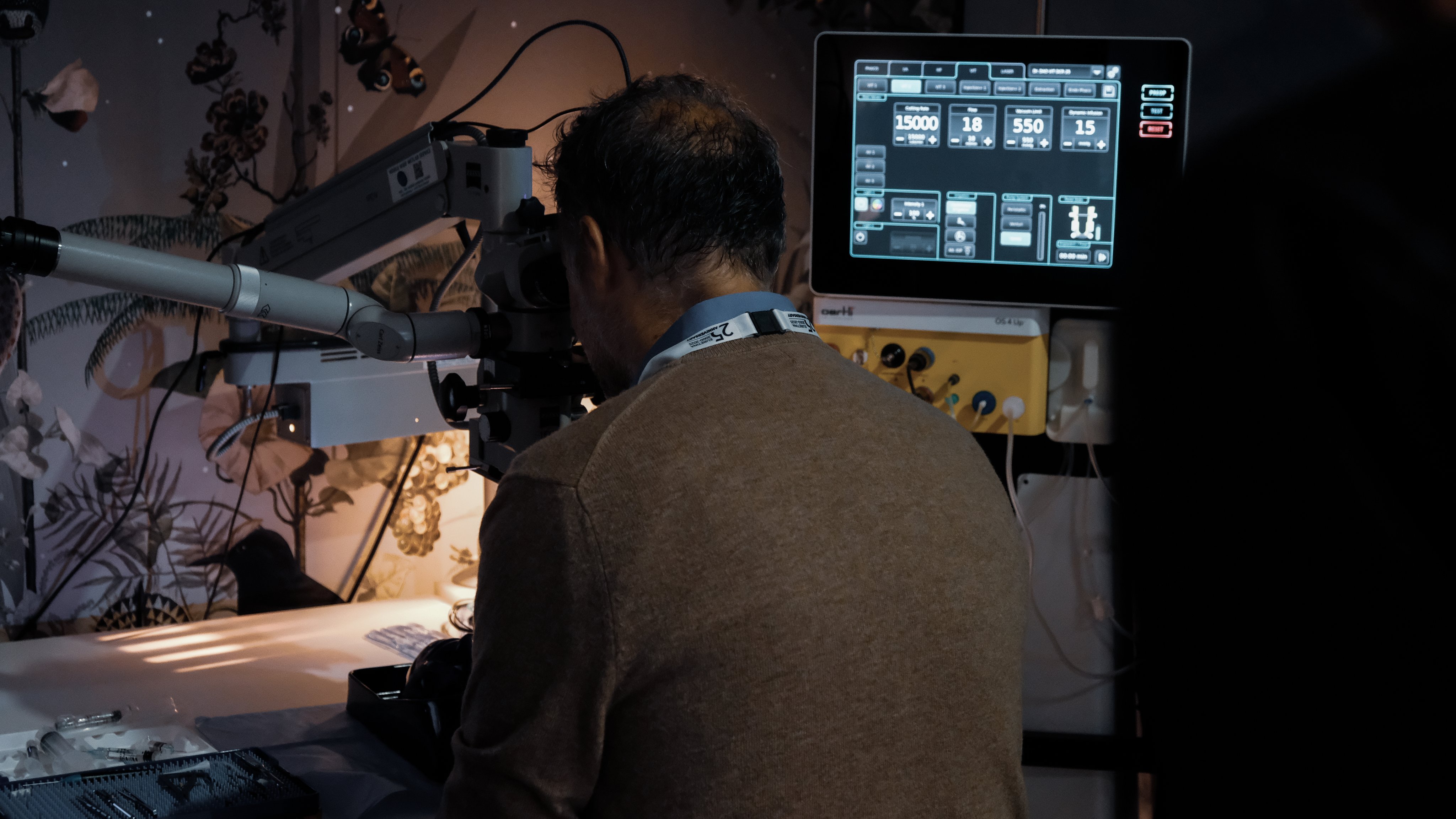 Visitor testing the OS 4 Up ophthalmic surgical system at a medical congress booth