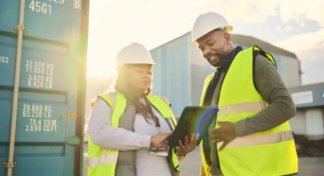 Ecommerce, supply chain and tablet with a man and woman working as a team in logistics, shipping and delivery. Teamwork, freight and cargo with a male and female at work in the export industry.