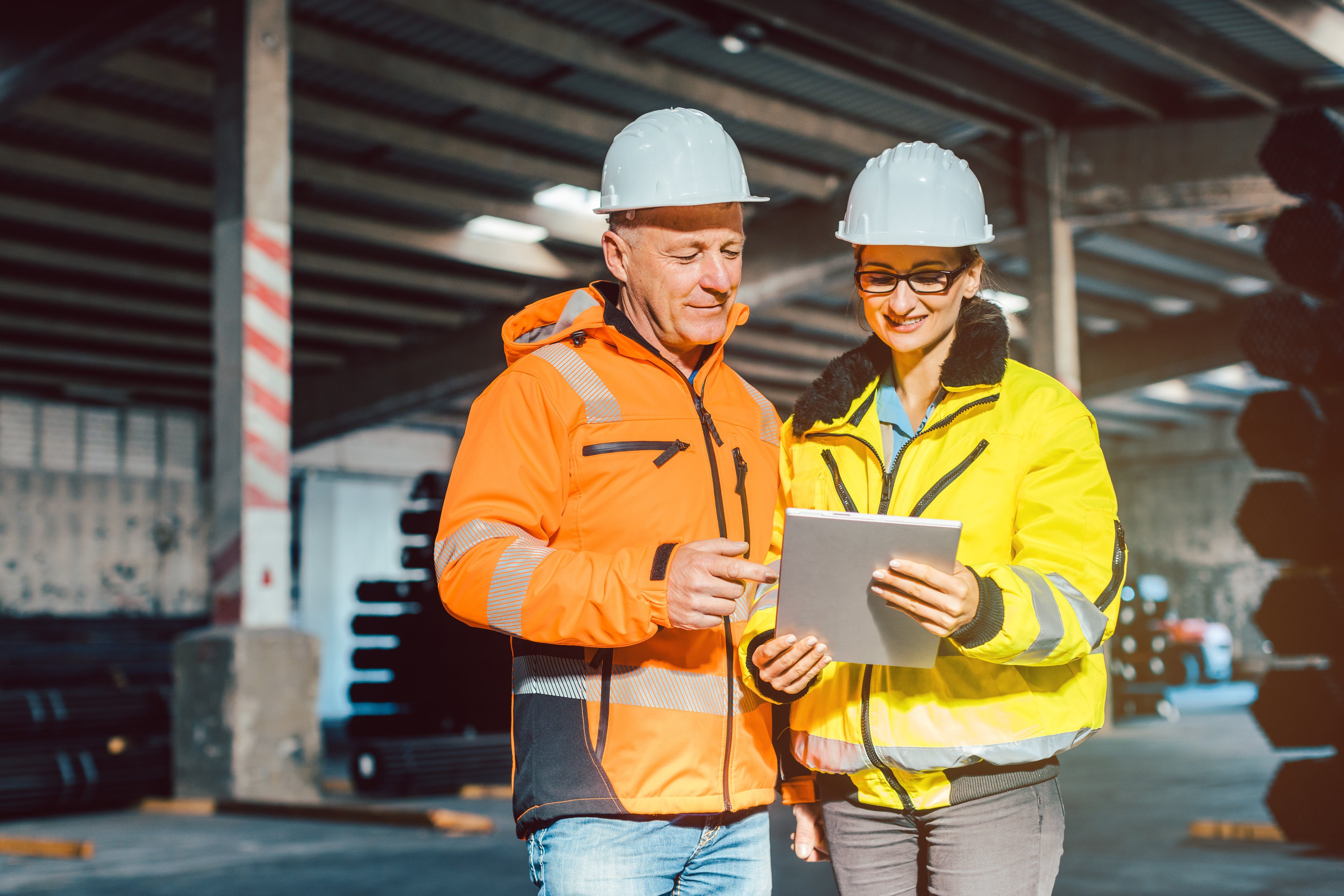 Workers checking inventory of logistics warehouse