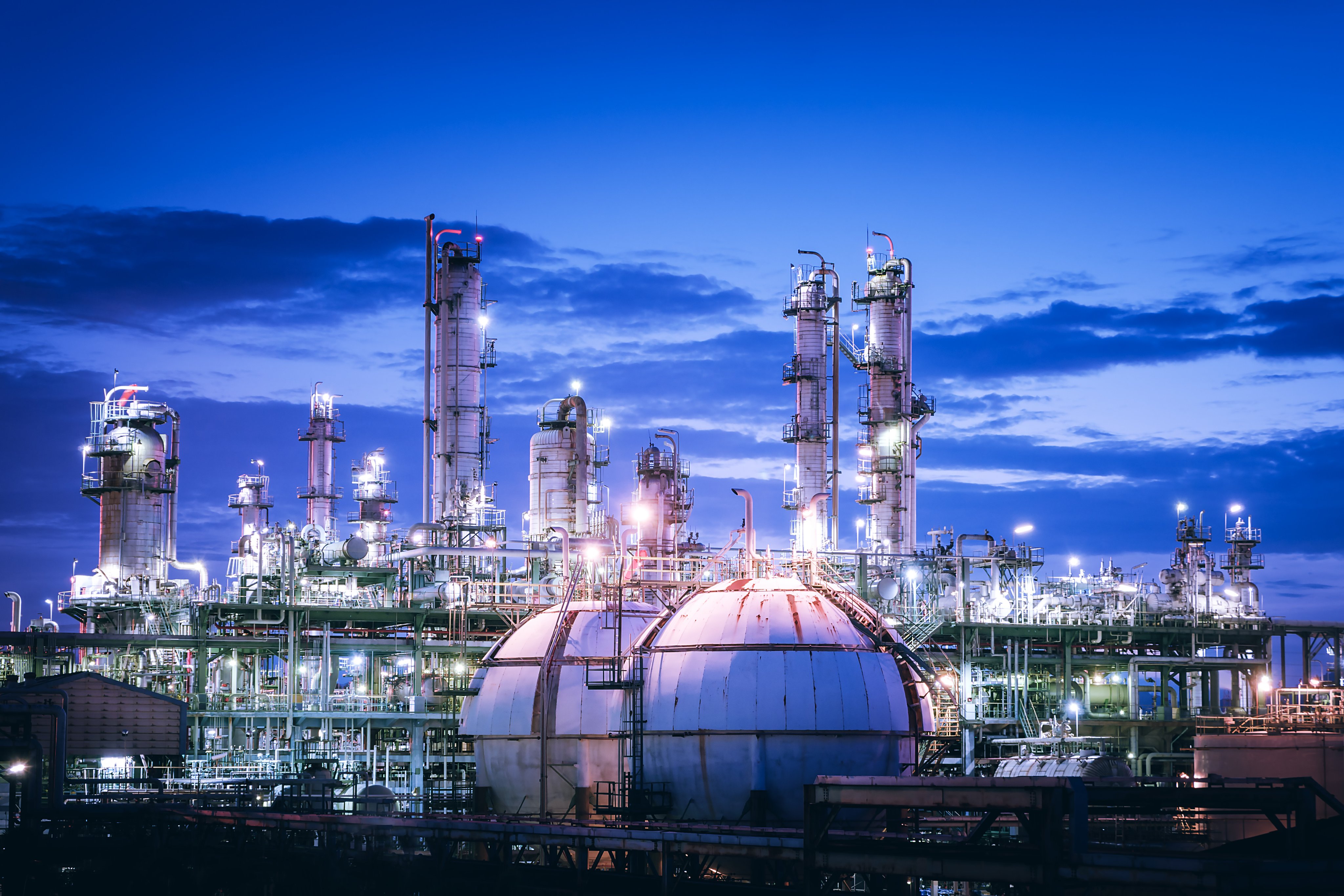 Gas storage sphere tanks in petrochemical plant with twilight sky background, Glitter lighting of industrial plant, Manufacturing of vinyl chloride monomer plant
