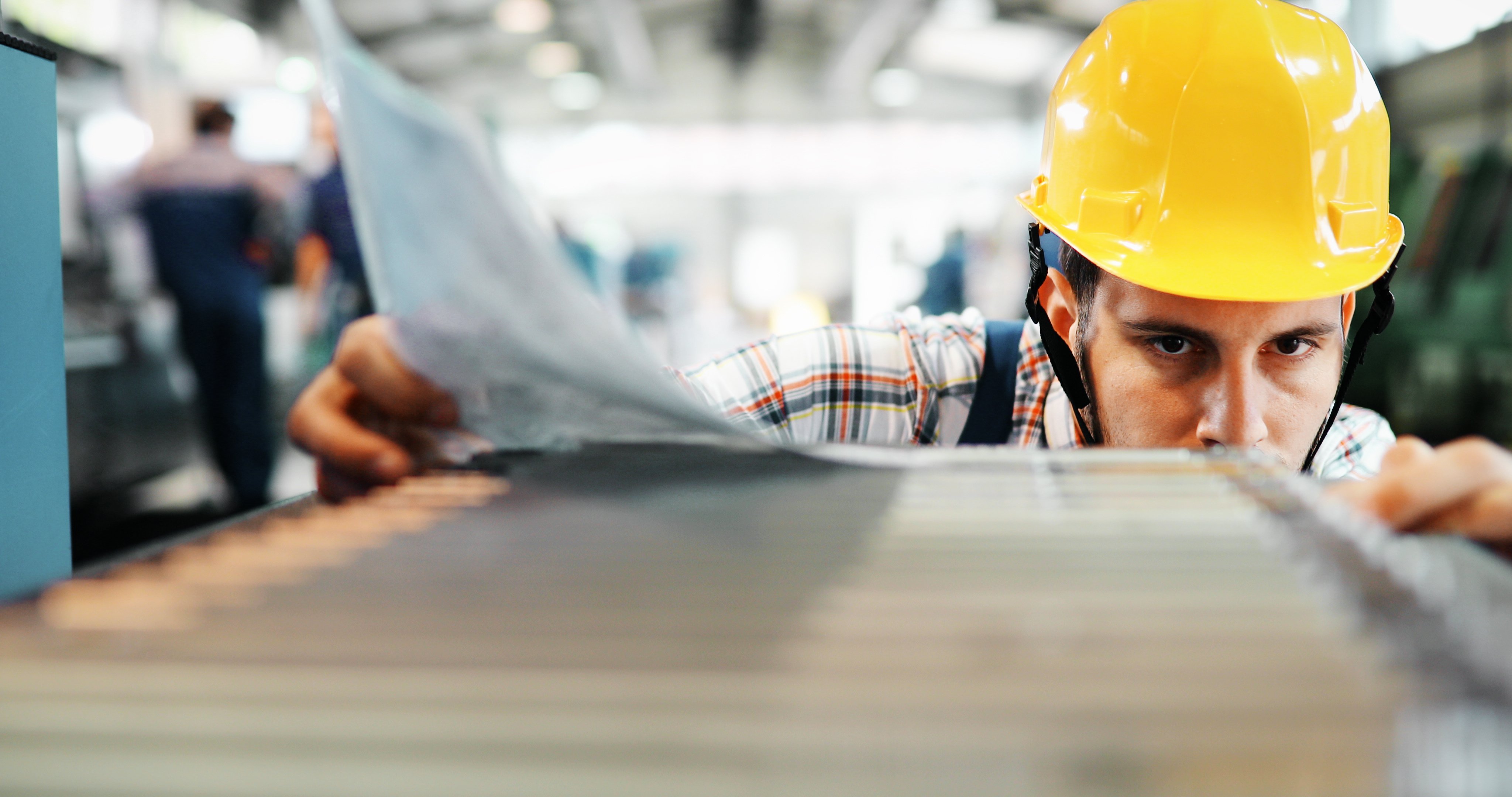 Supervisor doing quality control and pruduction check in metal factory