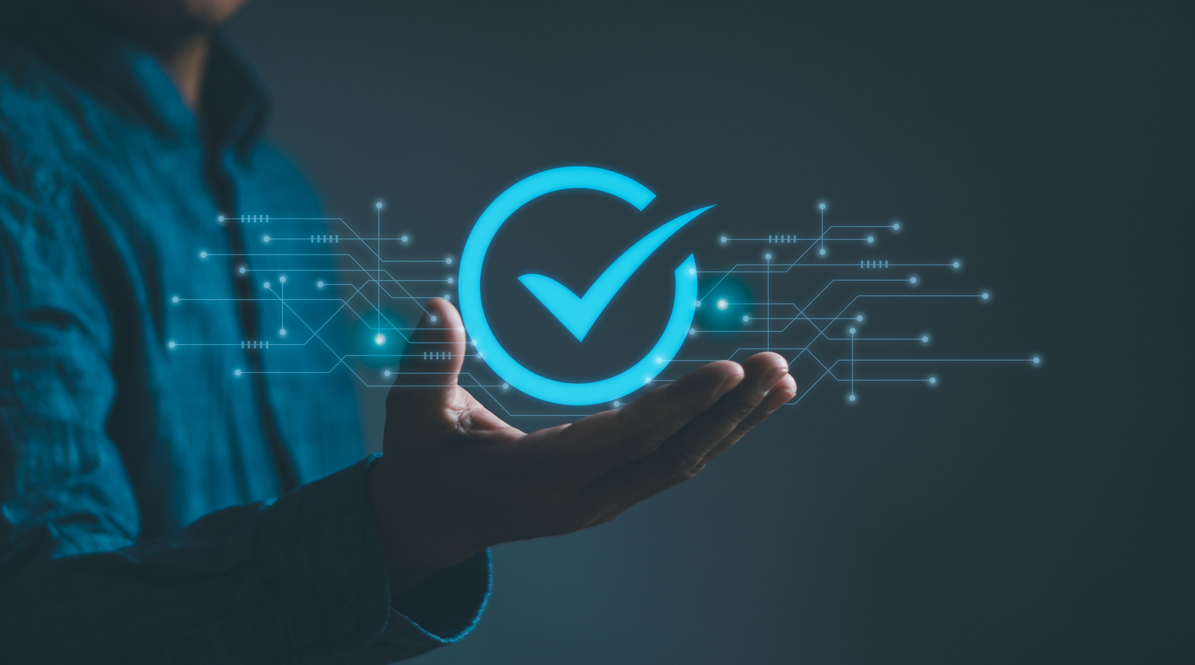 Businessman showing Quality Assurance (QA) with virtual screen on hand, concept Certification standards, quality control (QC), service assurance for business process automation.