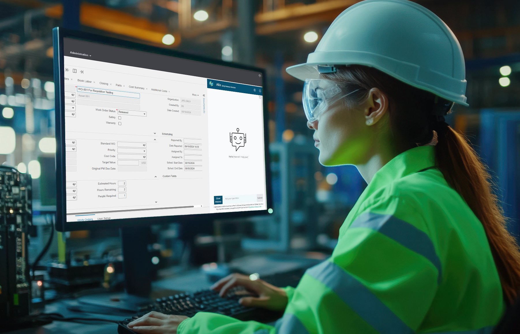 Female caucasian technician in hardhat. Working on a desktop computer with green screen chroma key mock-up display in a factory office. Autonomous technological research and development