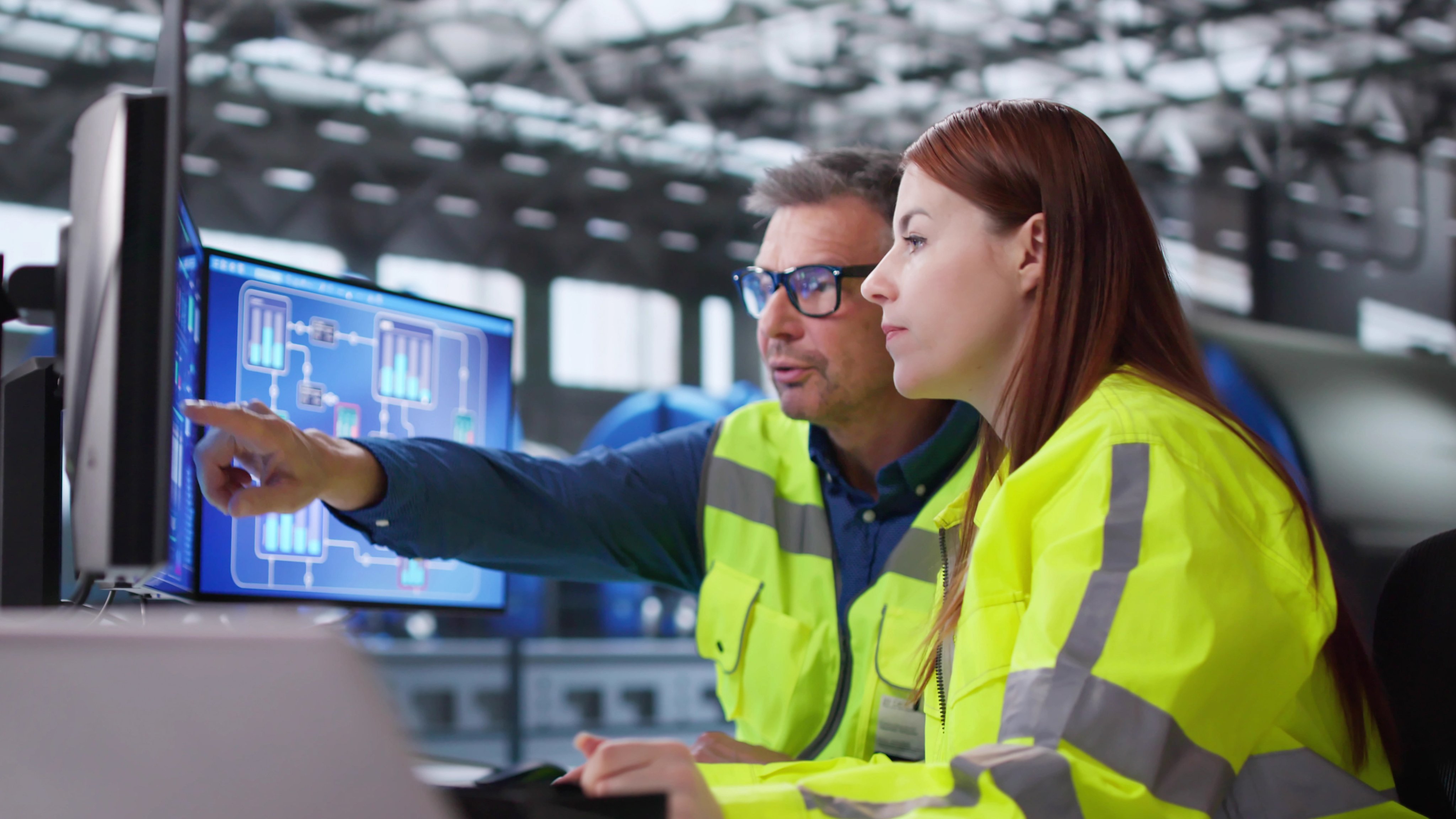 Engineer Operating Control Panel At Power Plant Generating Electricity For City.