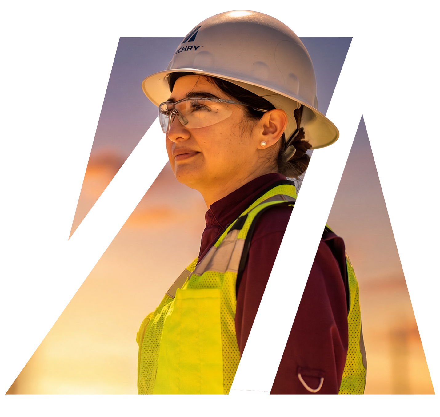Zachry construction professional wearing a hard hat, safety glasses and high-visibility vest at a job site.