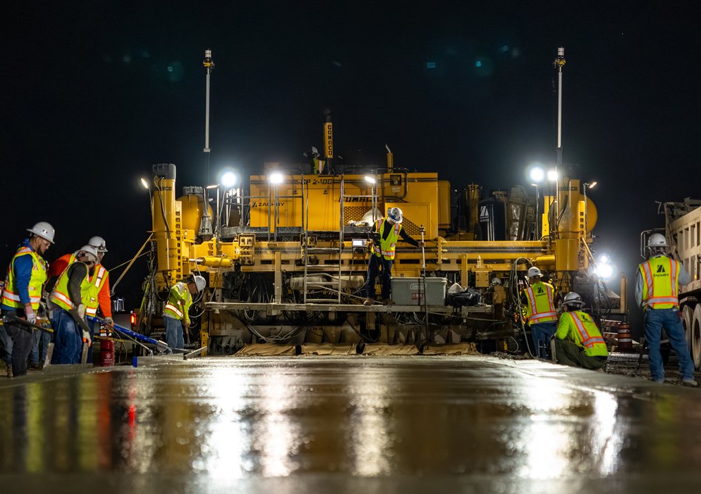 Zachry crews performing roadway paving work at night