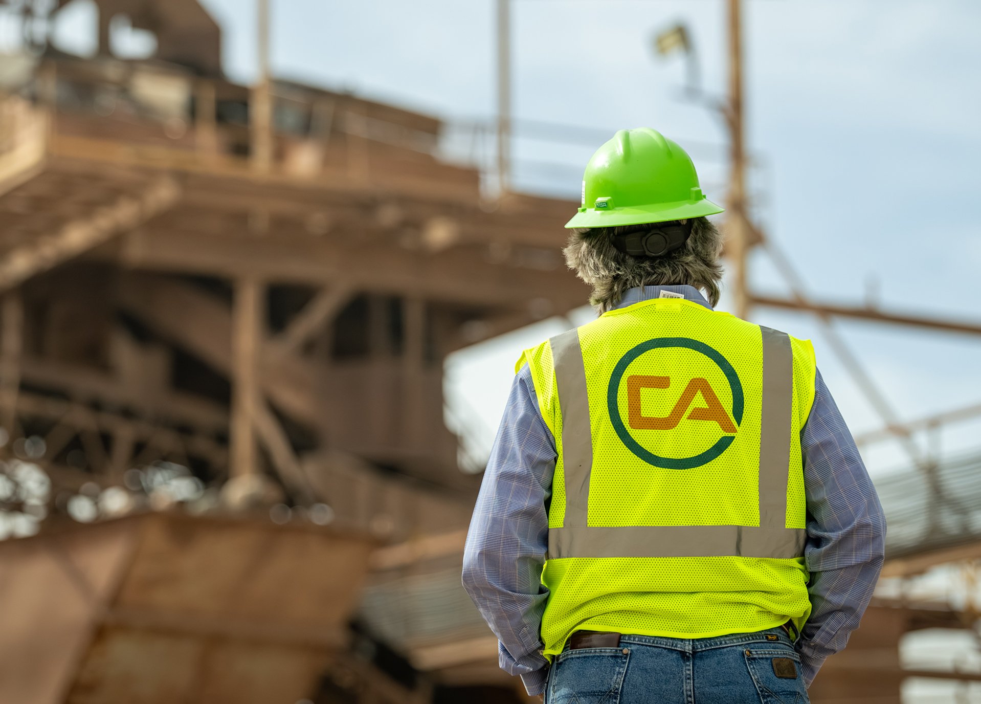 Capitol Aggregates team member wearing safety gear at an aggregate production facility