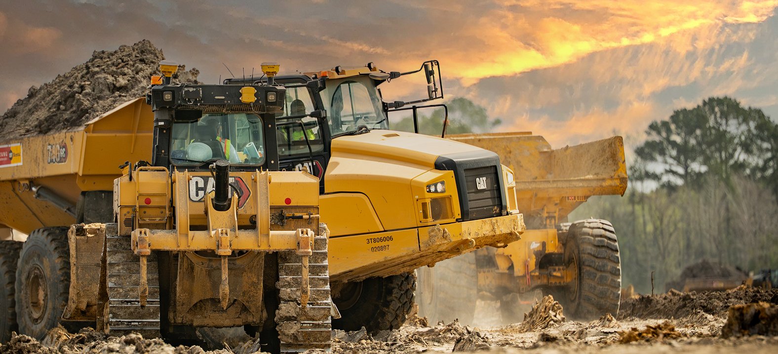 Heavy construction equipment performs earthwork at a Zachry project site