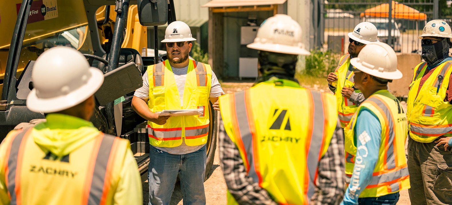 Zachry construction team members gather at a jobsite