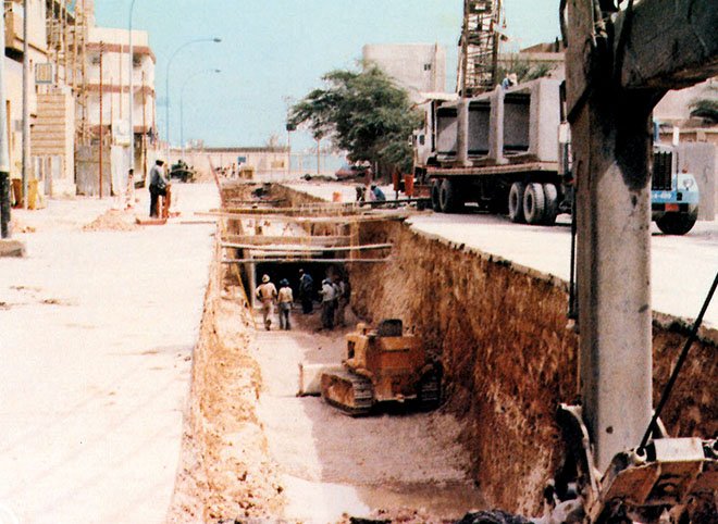 Crews install storm and sanitary sewer lines along a street in Riyadh, Saudi Arabia